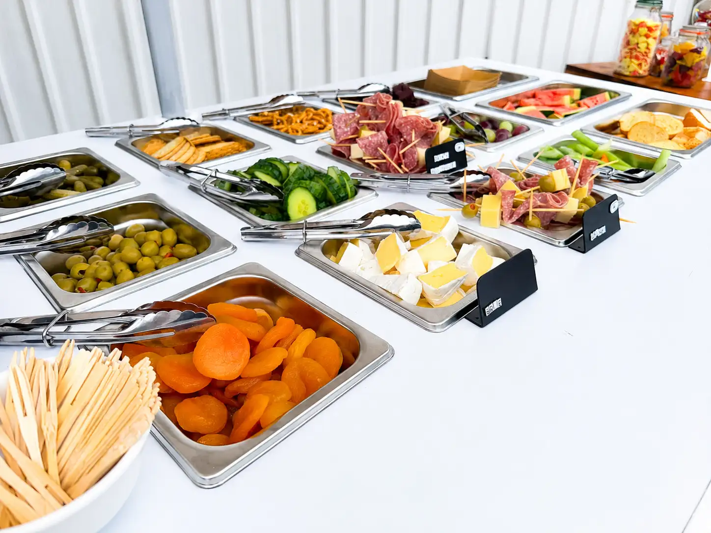 Guests enjoying a Coastal Cart Collective grazing setup at an event